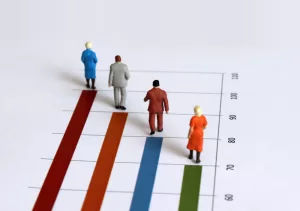 Model people on top of a bar graph