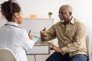 A man having a discussion with a physician